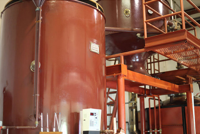 Tanks, tubing and scaffolding of Alambic's brandy still